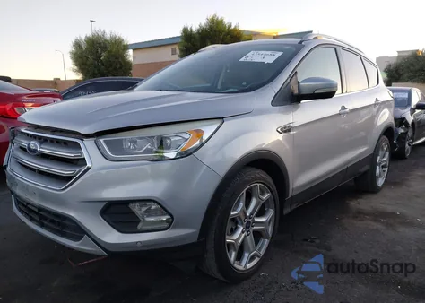 2017 Ford Escape Titanium z USA, uszkodzony, nr VIN 1FMCU0J94HUC80309